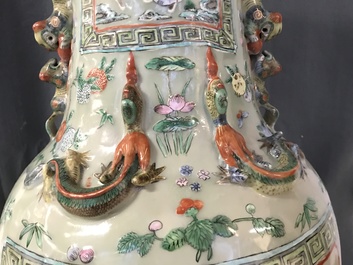 A pair of large Chinese famille verte celadon-ground vases with figural design, 19th C.