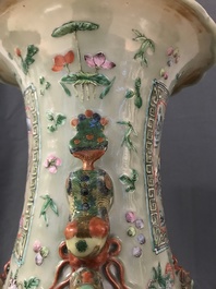 A pair of large Chinese famille verte celadon-ground vases with figural design, 19th C.