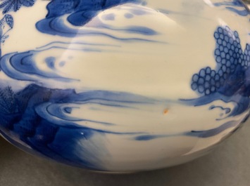 A Chinese blue and white bottle vase with figures in a landscape, Transitional period