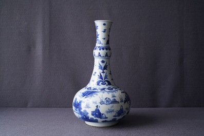 A Chinese blue and white bottle vase with figures in a landscape, Transitional period