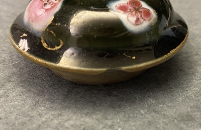 A pair of Chinese famille rose black-ground teapots and covers, Yongzheng/Qianlong