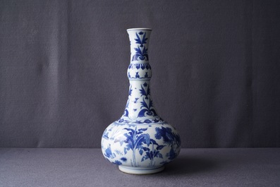 A Chinese blue and white bottle vase with figures in a landscape, Transitional period