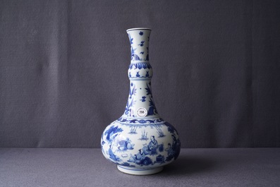 A Chinese blue and white bottle vase with figures in a landscape, Transitional period