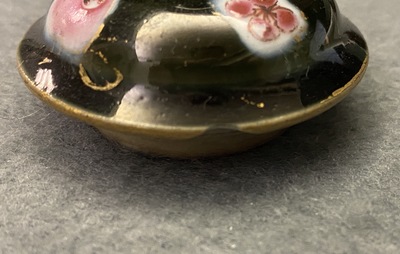 A pair of Chinese famille rose black-ground teapots and covers, Yongzheng/Qianlong