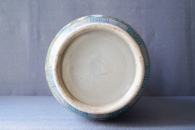 A Chinese brown- and celadon-ground famille rose vase, 19th C.