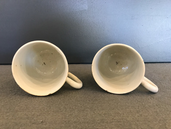 A pair of fine Chinese famille rose 'European subject' cups and saucers, Qianlong