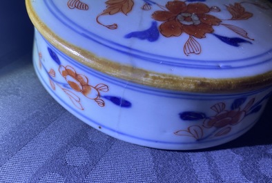 A pair of Chinese Imari-style 'qilin and phoenix' jars and covers, Kangxi
