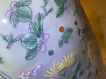 A pair of large Chinese famille verte celadon-ground vases with figural design, 19th C.