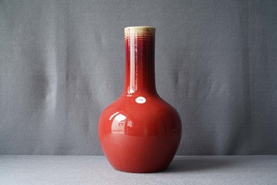 A Chinese monochrome sang-de-boeuf bottle vase, 19th C.