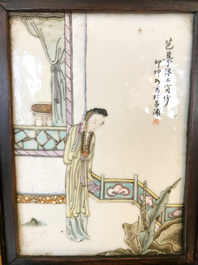 A Chinese wooden closet with 23 qianjiang cai plaques, 19/20th C.