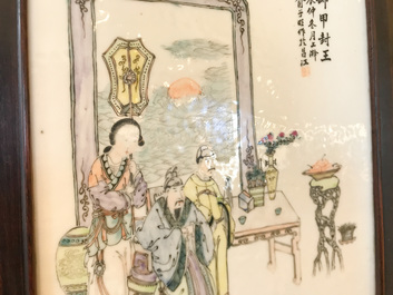A Chinese wooden closet with 23 qianjiang cai plaques, 19/20th C.