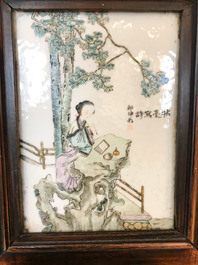 A Chinese wooden closet with 23 qianjiang cai plaques, 19/20th C.