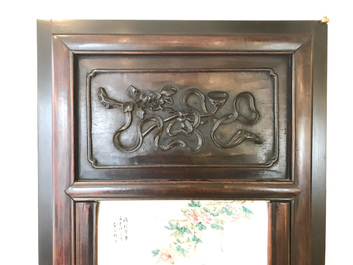 A Chinese wooden closet with 23 qianjiang cai plaques, 19/20th C.