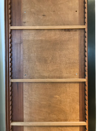 A Chinese wooden closet with 23 qianjiang cai plaques, 19/20th C.