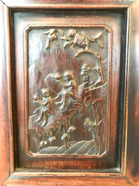 A Chinese wooden closet with 23 qianjiang cai plaques, 19/20th C.