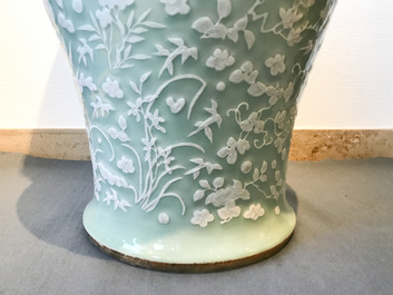 A large Chinese slip-decorated celadon-ground vase, 19th C.