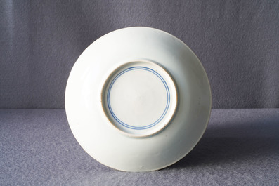 A Chinese blue and white plate with calligraphy and scholars rock, Shunzhi
