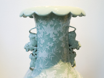 A large Chinese slip-decorated celadon-ground vase, 19th C.