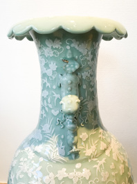 A large Chinese slip-decorated celadon-ground vase, 19th C.