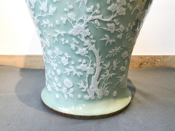A large Chinese slip-decorated celadon-ground vase, 19th C.