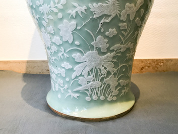 A large Chinese slip-decorated celadon-ground vase, 19th C.
