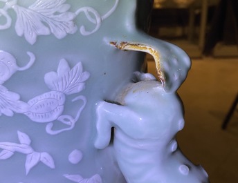 A large Chinese slip-decorated celadon-ground vase, 19th C.