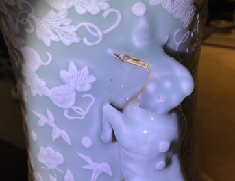 A large Chinese slip-decorated celadon-ground vase, 19th C.