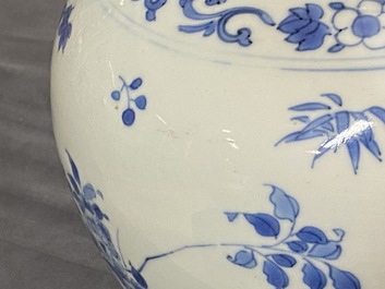 A Chinese blue and white bottle vase with floral design, Transitional period