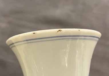 A Chinese blue and white bottle vase with floral design, Transitional period