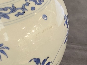 A Chinese blue and white bottle vase with floral design, Transitional period