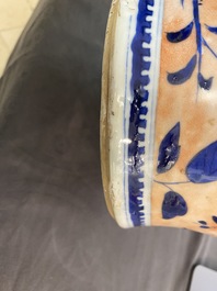 A Chinese blue and white clobbered 'qilin and phoenix' vase and cover, 19th C.