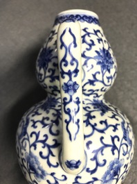 A Chinese blue and white 'bats and shou' jug, 19th C.