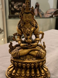 Five Sino-Tibetan gilt bronze Buddha figures, 19/20th C.