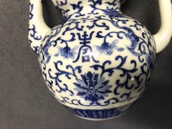 A Chinese blue and white 'bats and shou' jug, 19th C.