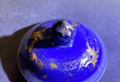 A Chinese gilt-decorated powder blue cream jug, a tea caddy and a tea bowl with roosters, Yongzheng