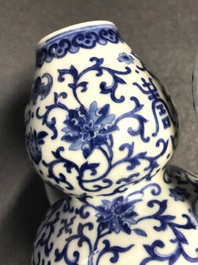 A Chinese blue and white 'bats and shou' jug, 19th C.