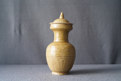 A Chinese brown-glazed vase and cover with incised design, Song