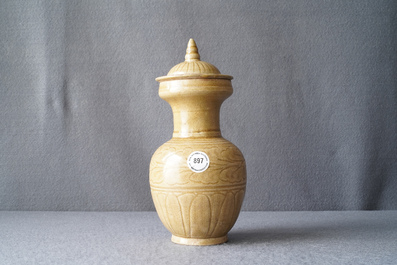 A Chinese brown-glazed vase and cover with incised design, Song