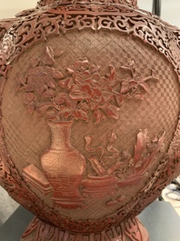 A Chinese carved cinnabar lacquer vase, Qianlong mark, 19/20th C.