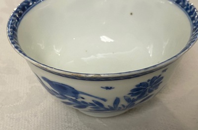 A Chinese blue and white 'mother with child' cup and saucer, Kangxi