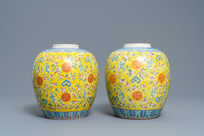 A pair of Chinese yellow-ground famille rose 'bats and shou' jars, Qianlong mark, 19th C.