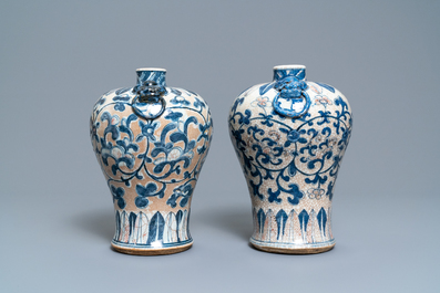 A pair of Chinese blue, white and copper-red meiping crackle-glazed vases, 19th C.
