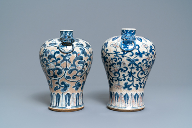A pair of Chinese blue, white and copper-red meiping crackle-glazed vases, 19th C.