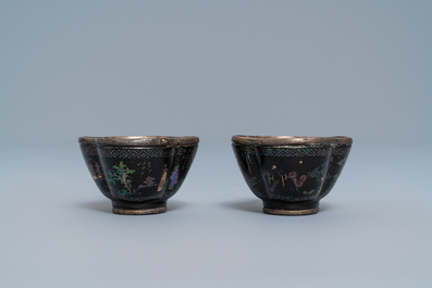 Three Chinese lac burgaut&eacute; saucers and two cups, Kangxi