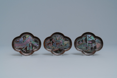 Three Chinese lac burgaut&eacute; saucers and two cups, Kangxi