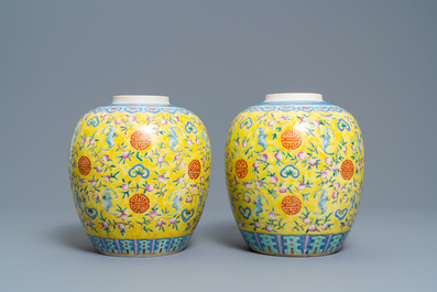 A pair of Chinese yellow-ground famille rose 'bats and shou' jars, Qianlong mark, 19th C.