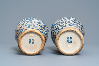 A pair of Chinese blue, white and copper-red meiping crackle-glazed vases, 19th C.
