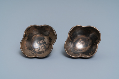 Three Chinese lac burgaut&eacute; saucers and two cups, Kangxi