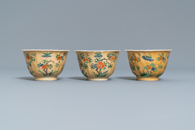 Six lobed Chinese famille verte caf&eacute;-au-lait-ground cups and saucers, Kangxi