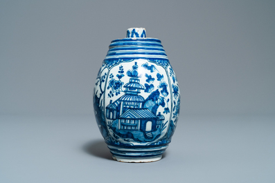 A Dutch Delft blue and white barrel-shaped gin flask with chinoiserie design, dated 1711